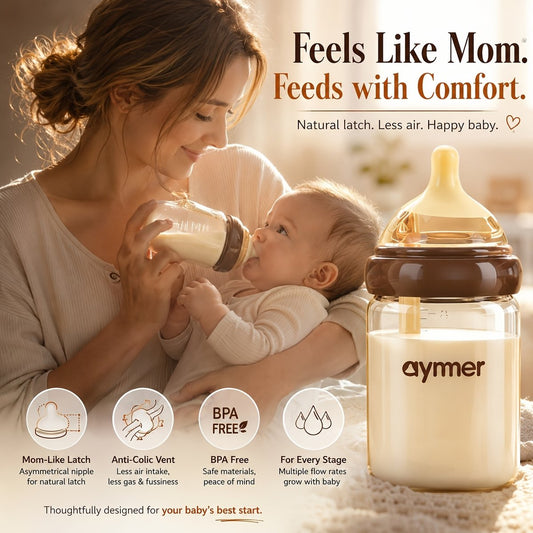 Mother feeding baby with IZZIE anti-colic wide neck baby bottle featuring breast-mimicking nipple